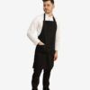 Delantal profesional de peto unisex color negro con bolsillo lateral y hebilla ajustable – Unifor Gran