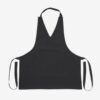 Delantal Tipo G para Mujer en color negro, con cuello tipo G, correas ajustables y tejido 100% poliéster antilejía y antimanchas – Unifor Gran