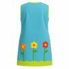 Bata de maestra personalizada en Popelín Galaxy color turquesa con apliques de tela de mariquita y flor sobre los bolsillos