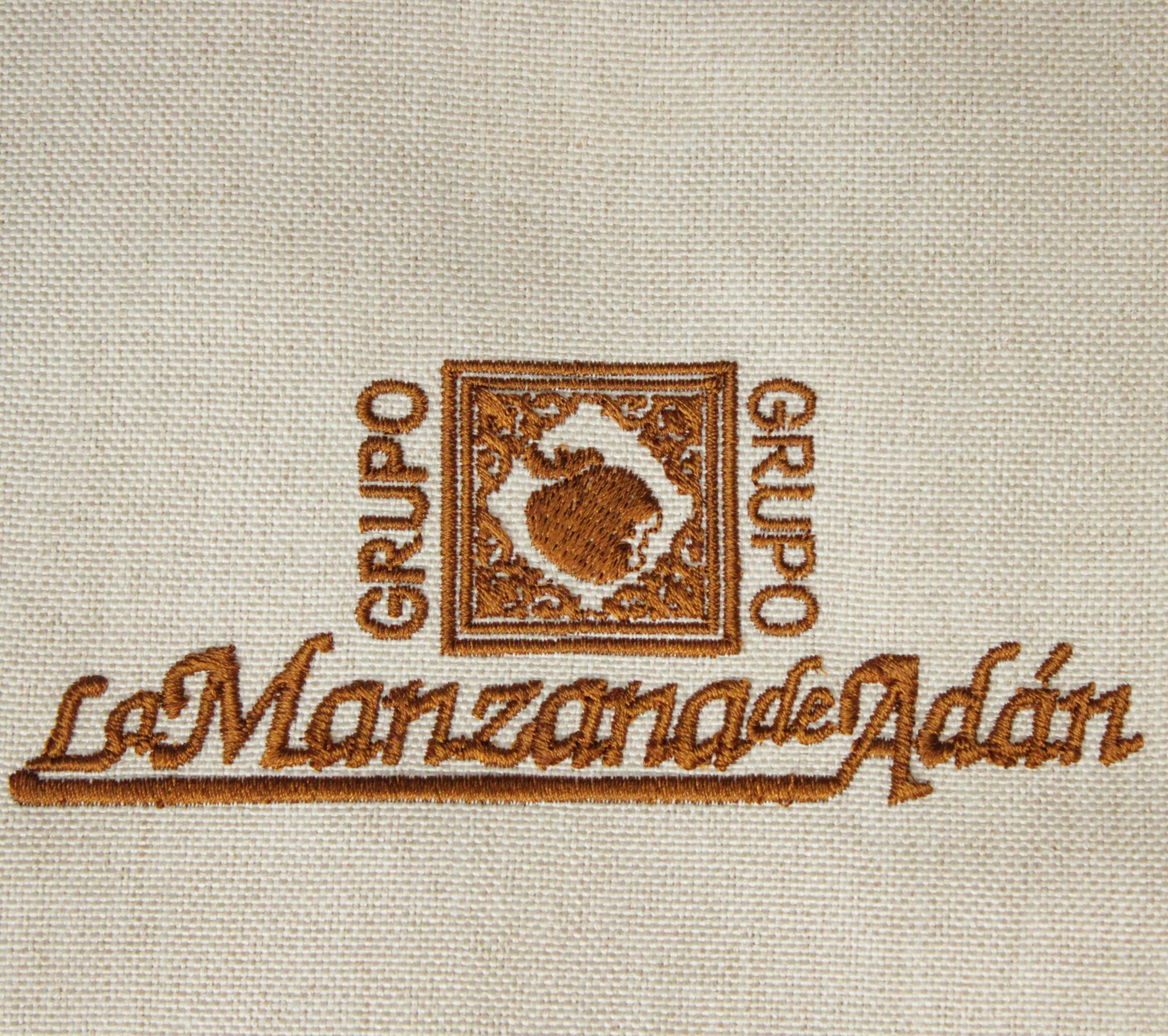 Logo bordado de Grupo La Manzana de Adán