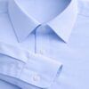 Detalle camisa celeste hombre cuello clásico y puño popelín Unifor Gran