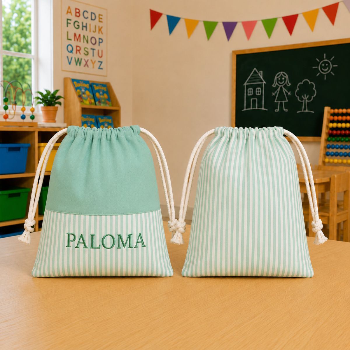 Bolsa escolar infantil personalizada de rayas verdes con nombre bordado PALOMA, confeccionada en tejido Popelín Galaxy para guardería y colegio.